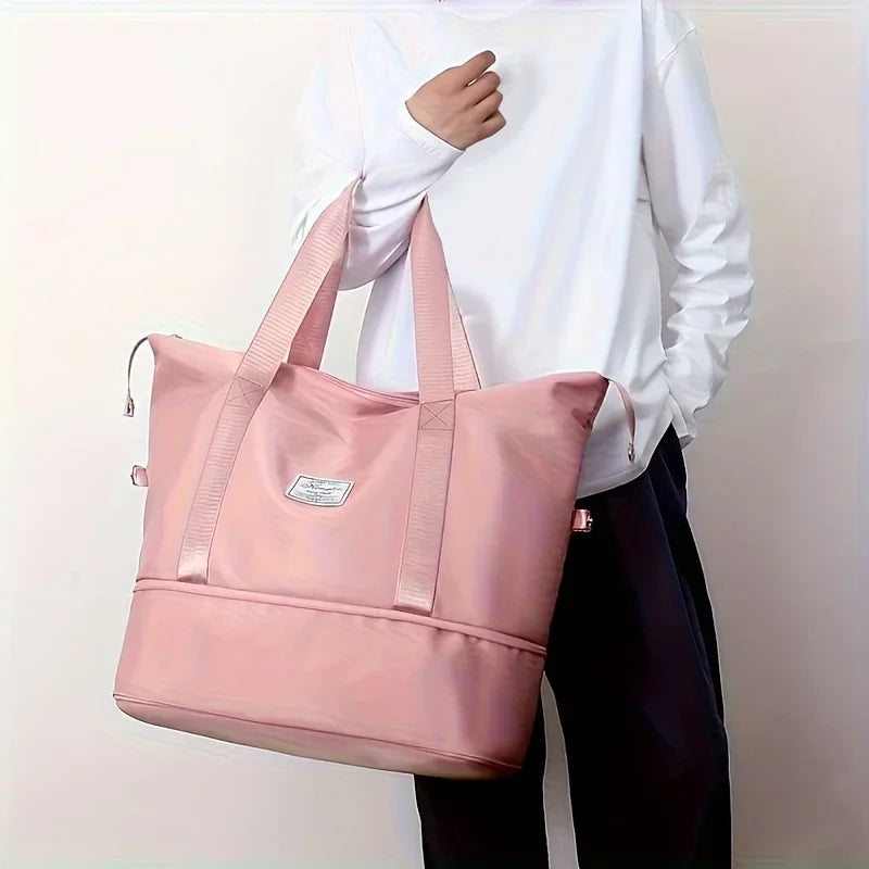 Woman holding a pink travel bag